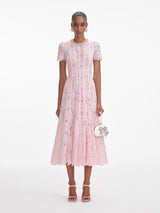 Front view of a woman wearing the Pink Lace Embellished Midi Dress