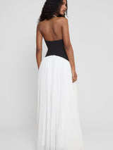 Model wearing Harlowe Contrast Corset Maxi Dress in White, back view.