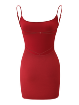 The MINERVA MINI DRESS by TIGERMIST is a sleeveless, form-fitting red bodycon dress with thin adjustable straps and subtle strap details on the chest and waist, shown against a white background.